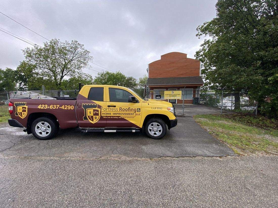 Fortress Roofing branded truck on a Chattanooga job site